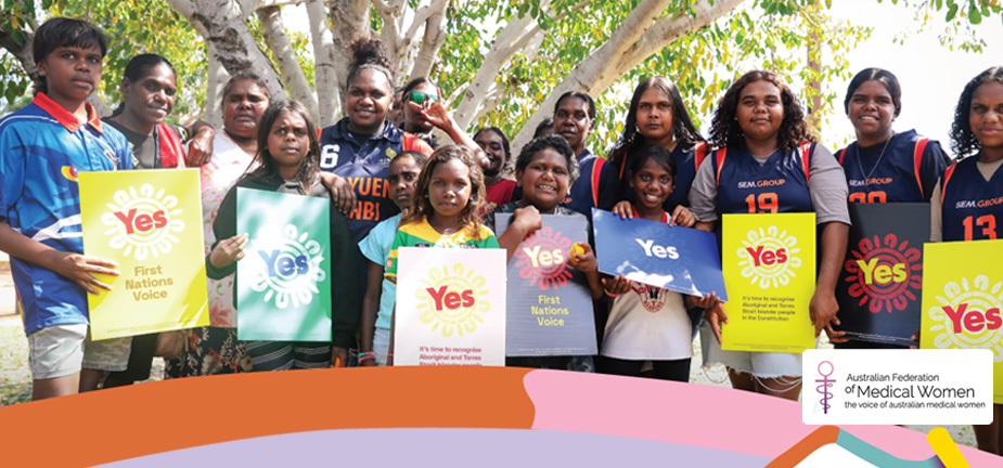 Australia's first people holding signs asking us to vote Yes to the Voice referendum