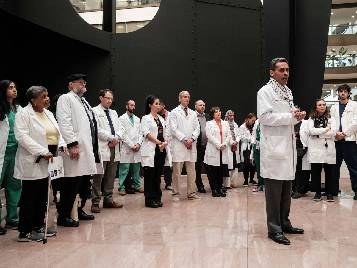 Large group of doctors standing against genocide